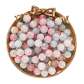Detail view of 10mm pink and blue gradient glass beads on a gold tray for DIY jewelry - Jade-Like Pink Blue Lampwork Beads
