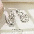 Polished silver stainless steel drop earrings with three geometric tiered rings - Triple Ring Drop