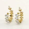 Macro detail of 18K gold-plated earrings with marquise-cut sparkling zircon stones - White