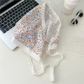 Flat lay of floral cotton triangle scarf with white lace trim and orange flower patterns - Orange Blue Purple Floral