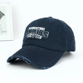 Close-up of distressed brim and vintage embroidery on this navy blue washed cotton cap - Letter Embroidery Distressed Style / Navy Blue