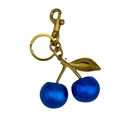 Blue cherry keychain pendant with gold leaf and metal lobster clasp on white background - Agate Blue Cherry with Bronze Gold