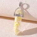 Macro shot of a resin crystal pendant featuring an artificial lemon slice and silver clasp - Resin Lemon