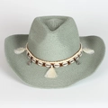 Detail of grey-green straw cowboy hat with shell trim and tassel on white background - Grey Green
