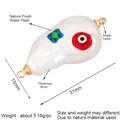 Baroque pearl Evil Eye pendant in gold finish with 31mm length and red star details - Silver/Blue Star Pearl (L344498)