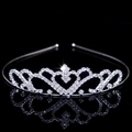 Close-up of silver bridal crown with sparkling rhinestones and heart details on black background - Style FG165