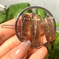 Handheld circular silver hair clip with brown natural raw crystal stones detail - Silver Circle Smoky Quartz Column