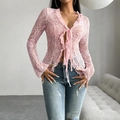 Pink lace long sleeve V-neck top with front tie and ruffle trim on model - S / Pink