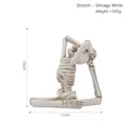 Distressed white resin skull figurine in stretching yoga pose for Halloween decor - Stretching - Distressed White