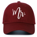 Macro shot of white Mr. embroidery on burgundy twill fabric of the baseball cap - MR / Burgundy