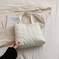 Minimalist beige heart quilted tote bag with soft fabric and magnetic closure for casual use - White