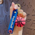 Pink basketball keychain with navy blue silicone strap and golden metal ring - Basketball