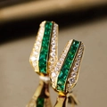 Exotic gold plated shield earrings with emerald green gemstones and white micro zircon - Gold