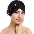 Detail of black turban hat with three 3D fabric flowers and white pearl centers - Black