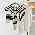 Knitted black and white striped shawl wrap tied over a white long sleeve shirt - Off-white Base Black Stripe