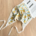Detailed flat lay of white lace floral headscarf with yellow flowers on wooden surface - Yellow
