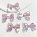 Five pink holographic ribbon bow beads with shimmering UV glow finish for DIY jewelry - 1 Bead / Glowing Glitter Light Pink