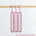 Pink 3-pack magic clothes hangers with 9 holes for space-saving horizontal or vertical use - Nordic Pink