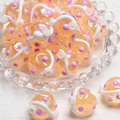 Macro shot of orange glass beads with purple dots and 3D white floral details - 18mm / Orange Bead + Purple Dot + Creamy White Flower