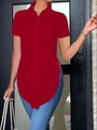 Detail of red short sleeve polo shirt featuring side slit hem and button-down front - Red
