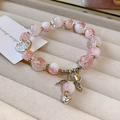 Pink gradient beaded bracelet with silver wing and heart charms on a velvet jewelry tray - Silver Pendant Style (157) / Pink and White