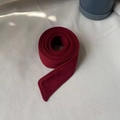 Detail of deep red wool belt for winter coat showing high-quality double stitching - Dark Red