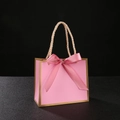 Elegant pink paper gift bag with silk ribbon bow and gold trim with twisted handles - Pink Bag Gold Border + Pink Ribbon
