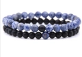 Blue marble stone and matte black bead distance bracelet set for couples on white background - Sodalite