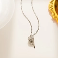 Detailed view of silver sunflower necklace pendant with sparkling zircon gemstones - Flower Stem and Leaf Style (584) / Silver