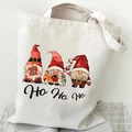 White canvas tote bag featuring Christmas gnomes print and Ho Ho Ho lettering - White