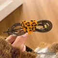 Brown semi-transparent shark hair claw clip with yellow leopard print heart detail 11cm - 11cm / Twist Clip Heart Shape Leopard