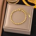 Gold Polished Bead Strand Bracelet
