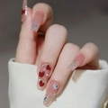 Long nude press-on nails with red hearts, glitter gradient, and rhinestone accents - HY263 Nude Heart Rhinestone