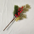 Close-up of glittery gold leaves and red berries with green pine needles on fabric - Golden Pine Berry Branch