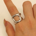 Detail of silver hollow geometric wide ring with irregular minimalist cutout on finger - Steel Geometric Hollow (6465)