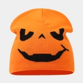 Macro view of high-quality orange knitted fabric and black pumpkin pattern embroidery - Style B Orange (Evil Pumpkin Face)