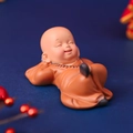 Cute nodding monk car ornament in orange robe lying posture with prayer beads - Single Leg Up Pose (No. 22)
