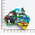 Map-shaped resin Australia Cairns fridge magnet featuring train and crocodile motifs - Cairns Scenic Map