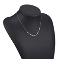 Bohemian gold chain necklace featuring blue and white turquoise style beaded accents - Blue White Cylindrical Clay Beads