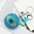 Blue Evil Eye heart keychain with sparkling rhinestones, tassel, and silver bell charm - Lake Blue Pointy Eye Silver Clasp