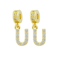 Golden letter U earring pendant with micro-paved cubic zirconia crystals in close-up view - Letter-U