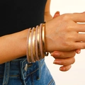 7-piece gold bangle set featuring polished mirror finish and fine glitter textures on wrists - 13 KC Gold A-611 (8-Piece Set)