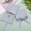 Light blue faux suede jewelry pouches with ribbon bow closure for pearl bracelets - Light Blue