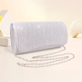 Detailed view of silver evening clutch bag featuring vertical texture and silver chain strap - Silver