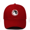 Close-up of Yin Yang Tai Chi embroidery and SWIMMING text on red cotton baseball cap - Adjustable / Burgundy
