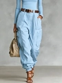 Detail showing high-waist cargo pants with side pockets and a stylish brown belt - Light Blue