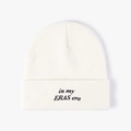 Detail of 'in my ERAS era' black embroidery on off-white knitted winter beanie - One Size / White
