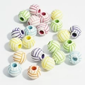 Macro shot of colorful acrylic volleyball-shaped beads for handmade DIY jewelry crafting - 12mm Volleyball White Background Colorful Line