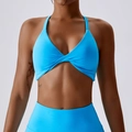 Bright blue seamless yoga sports bra with cross-knot twist front and thin straps - Teal