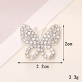 Macro view of a 2cm silver butterfly charm with rhinestones for DIY shoe and phone case - D1493 Silver Butterfly